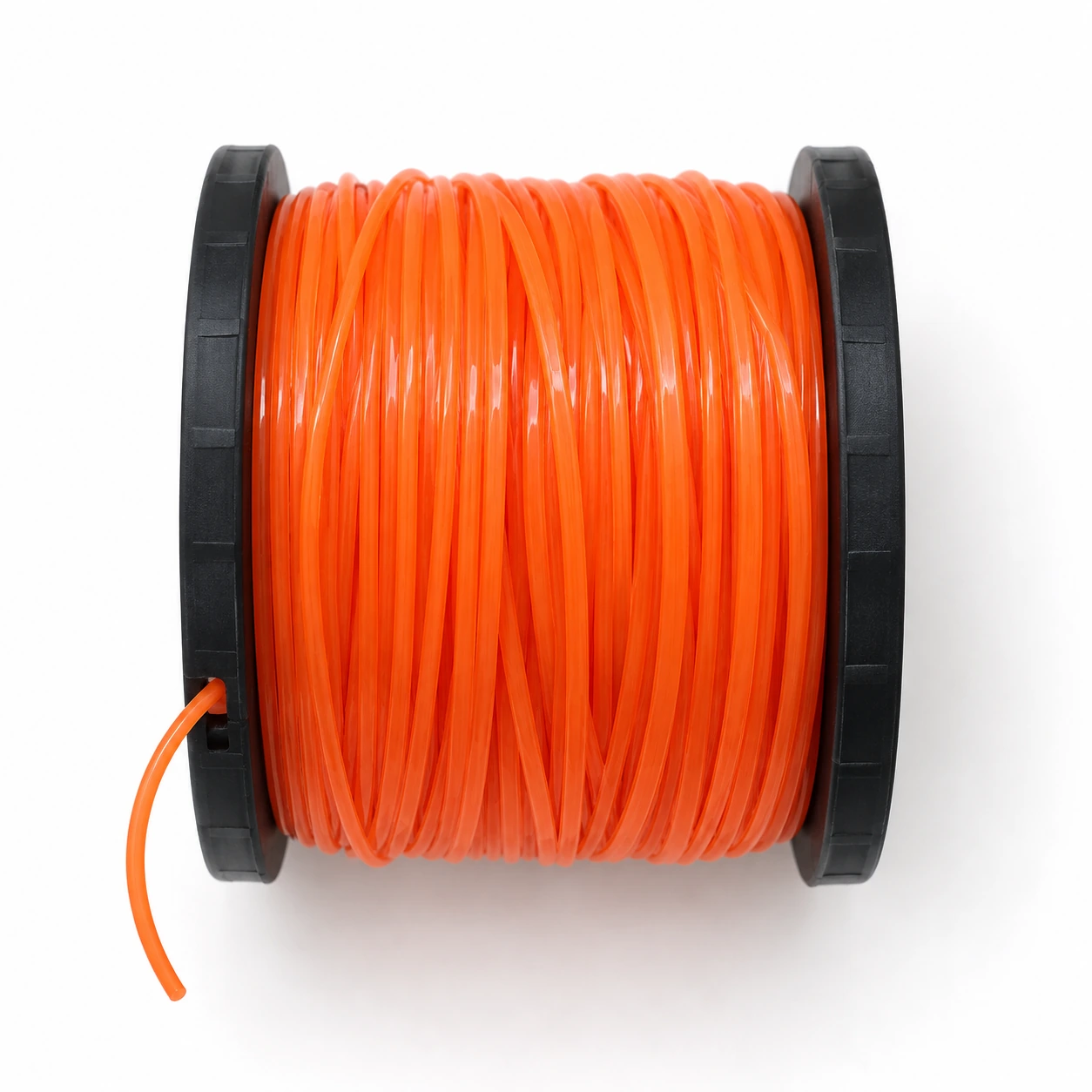 Contenu du colis vu de dessus, une bobine de fil de coupe orange à flasques noires